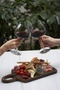 Couple with glass of red wine in outdoor restaurant Royalty Free Stock Photo