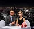 Couple with glasses of champagne at restaurant Royalty Free Stock Photo