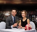 Couple with glasses of champagne at restaurant Royalty Free Stock Photo