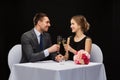 Couple with glasses of champagne at restaurant Royalty Free Stock Photo