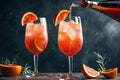 A couple of glasses filled with liquid and orange slices. Generative AI image.