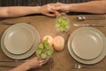 Couple with glasses of fresh cucumber water having romantic dinner Royalty Free Stock Photo