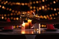 Couple with glasses of wine having romantic candlelight dinner at table