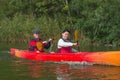 The couple goes kayaking on the river. Royalty Free Stock Photo