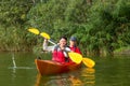 The couple goes kayaking on the river. Royalty Free Stock Photo