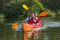 The couple goes kayaking on the river. Royalty Free Stock Photo