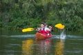 The couple goes kayaking on the river. Royalty Free Stock Photo