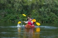 The couple goes kayaking on the river. Royalty Free Stock Photo