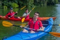 The couple goes kayaking on the river. Royalty Free Stock Photo