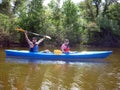 The couple goes kayaking on the river. Royalty Free Stock Photo