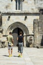 A couple goes to the entrance of a church