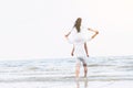 Couple going honeymoon on tropical beach in summer