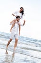 Couple going honeymoon on tropical beach in summer