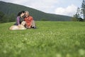 Couple With Golden Retriever On Grass Royalty Free Stock Photo