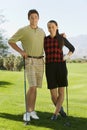 Couple of golfers standing on golf course Royalty Free Stock Photo