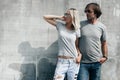 Couple in gray t-shirt over street wall