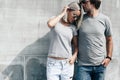 Couple in gray t-shirt over street wall Royalty Free Stock Photo