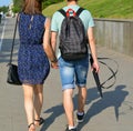 Couple walk on a street road summer time in the Minsk city Belarus