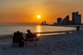 Couple on Gulf Shores Beach at Sunset