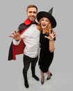 Couple in halloween costumes of witch and vampire Royalty Free Stock Photo