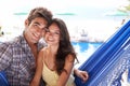 Couple, hammock and beach on holiday with smile for love, travel and vacation for honeymoon in Mauritius. Portrait