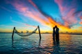 Couple on hammock on sunset