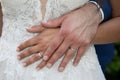 couple hand wedding rings on bride and groom fingers hands on marriage white dress Royalty Free Stock Photo