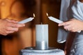 Couple, hands and candle at wedding for love, unity and commitment at church or ceremony with closeup. Marriage, man and Royalty Free Stock Photo