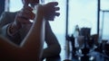 Couple hands clinking glasses restaurant closeup. Two people cheering concept