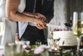 Couple Hands Cutting Wedding Cake Royalty Free Stock Photo