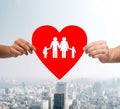 Couple hands holding red heart with family Royalty Free Stock Photo