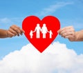 Couple hands holding red heart with family Royalty Free Stock Photo