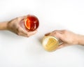 Couple of hands holding two glasses of red cocktail Royalty Free Stock Photo