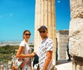 Couple is happy on ancient temple Parthenon in Acropolis Athens Greece and blue sky background. Royalty Free Stock Photo