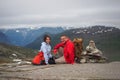 Couple of happy backpack tourist on the top of the mountain