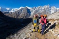 Couple happy backpackers standing Himalaya snow trail. Royalty Free Stock Photo