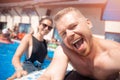 Couple happy caucasian beautiful young woman and man make selfie photo on background swimming pool. Concept travel Royalty Free Stock Photo