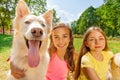 Couple happy girls with funny dog Royalty Free Stock Photo