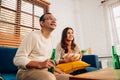 Couple of happy husband and wife watching sports match together Royalty Free Stock Photo