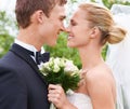 Couple, happy and love for wedding celebration in outdoors, together and smiling in nature. People, nose touch and Royalty Free Stock Photo