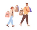 Couple of happy modern man and woman walking together with shopping bags. Young smiling people carrying purchases from Royalty Free Stock Photo