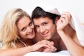 Couple has fun in bed. Laughter, joy and eroticism