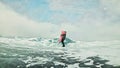 Couple has fun during winter walk against background of ice of f