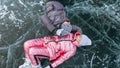 Couple has fun during winter walk against background of ice of f