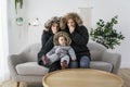 Couple have cold on the sofa at home with winter coat with baby Royalty Free Stock Photo