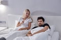 married couple have quarrel in bed at home. annoyed stressed man and woman arguing. Royalty Free Stock Photo