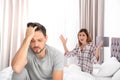 Couple having argument in bedroom. Royalty Free Stock Photo