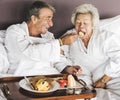 Couple having breakfast in bed Royalty Free Stock Photo