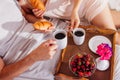 Couple having breakfast in bed Royalty Free Stock Photo