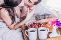 Couple having breakfast in bed Royalty Free Stock Photo